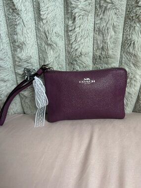 Coach leather wristlet in plum